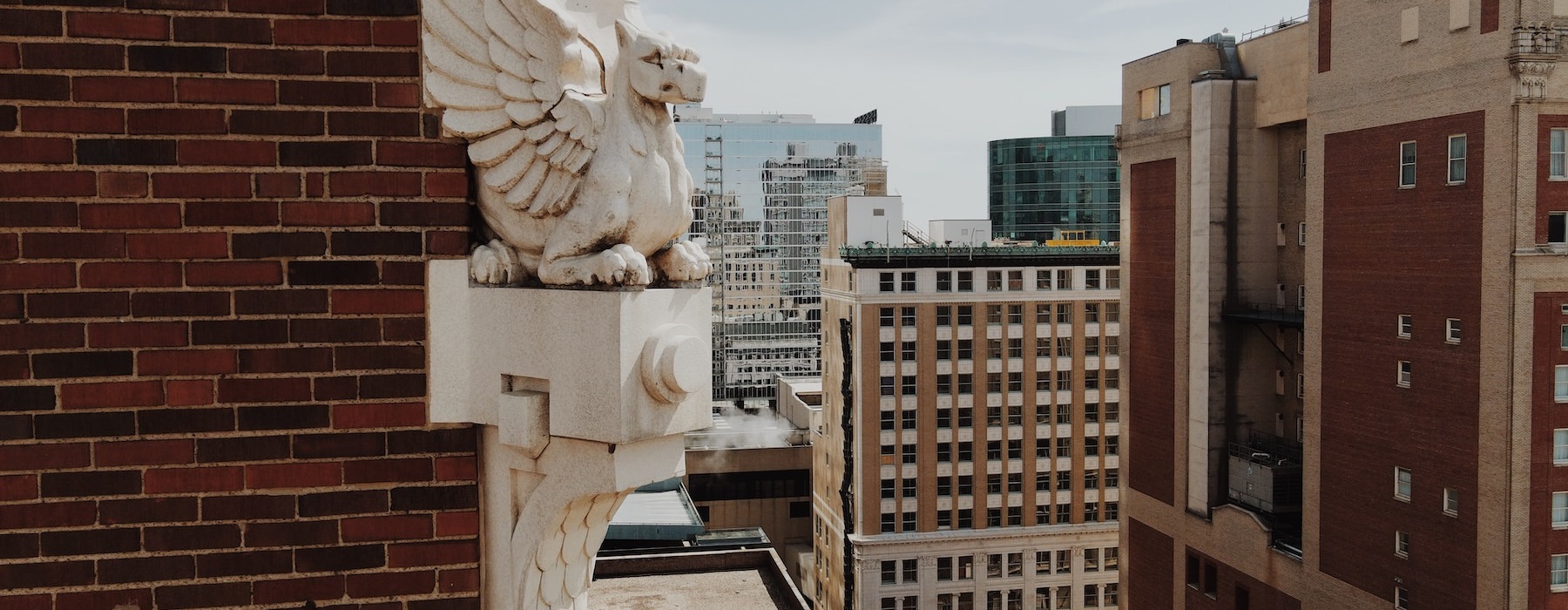 a statue on a brick wall