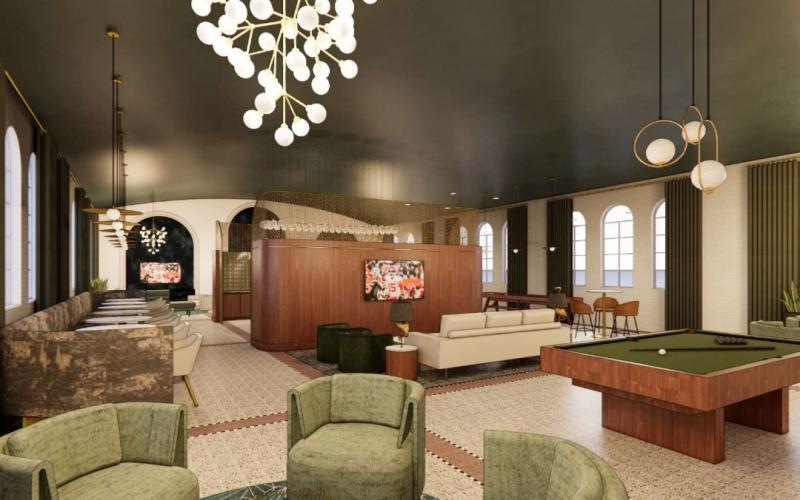 a room with a pool table and chairs